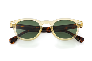 Lunettes de soleil Golden Snake Sunrise Ibiza, monture champagne dorée et verres verts profonds, collection Signature